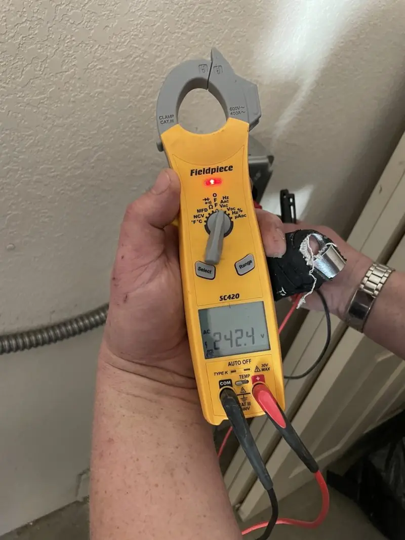 Voltage testing with clamp meter during Electrical Installation Services in St. Albans